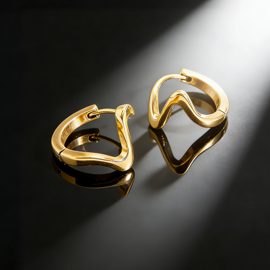 Guldfärgade vågformade örhängen